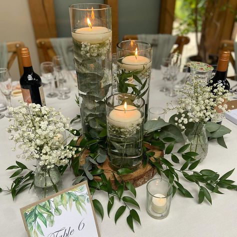 Flossie's Weddings & Occasions | Take a look at the many styles that floating candles can bring to coordinate with your theme and decor. Whether it’s a rustic centrepiece… | Instagram Flowers And Candles Centerpieces Wedding, Floating Candles Wedding Centerpieces Reception Ideas, Floating Candles Table Decor, Floating Candle Ideas Table Decorations, Rustic Venue Decor, Wedding Flower Centrepiece, Floating Candles Decor, Floating Candles Wedding Centerpieces, Candle Centerpieces Wedding