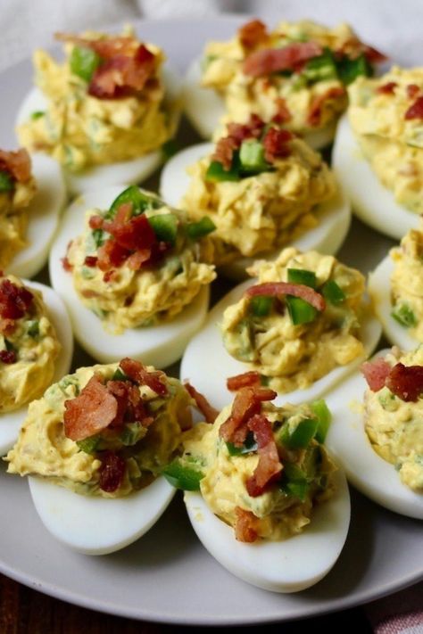 Deliciously dairy-free, these creamy and spicy deviled eggs with a jalapeno bacon filling make the perfect addition to your game day menu. Whether you are watching the game with friends or by your self, these salty and spicy deviled eggs need to be on your menu! Devil Eggs Recipe, Jalapeño Deviled Eggs, Southern Deviled Eggs Recipe, Deviled Eggs With Bacon, Devil Eggs, Jalapeno Deviled Eggs, Eggs With Bacon, Jalapeno Bacon, Spicy Deviled Eggs