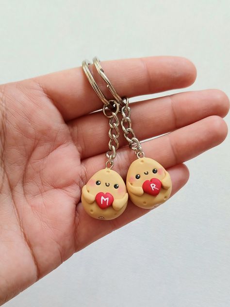 Cute potato keychains for best friends or couples. The charms measure about 2 cm and are made by hand, from polymer clay. Since we do not use molds or forms, the models may slighly vary from the picture. You can order one keychain or a set of more keychains. Please fill the desired letters with your order. * Each product comes in a cute packaging. * Visit our shop to see all the products: https://www.etsy.com/shop/nahootdesignshop/?etsrc=sdt Couple Keychains Clay, Best Friends Clay Ideas, Clay Ideas For Girlfriend, Couple Clay Keychain, Clay Keychain Diy Best Friends, Couples Clay Ideas, Couple Clay Ideas, Couple Clay Art, Clay Date Ideas