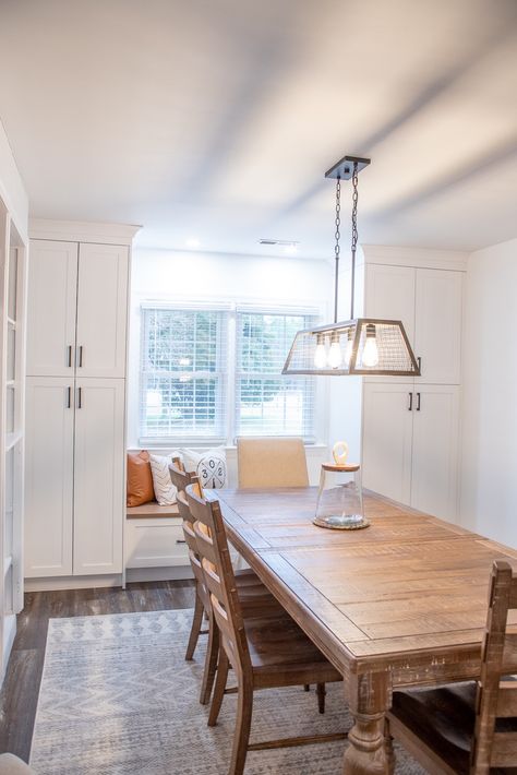 White shaker style cabinetry. Two tall pantry cabinets with a bench seat under a window. Kitchen Bench Seating Under Window, Dining Room Pantry, Window Bench Seat, Tall Pantry Cabinet, Window Seat Kitchen, Bench Seating Kitchen, Corner Pantry, Pantry Wall, Window Benches