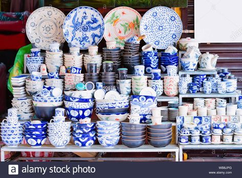 Traditional Vietnamese blue porcelain utensils with plates and cups and bowls on dispay at street market in Hoi An old city in Southeast Asia in Vietn Stock Photo French Vietnamese Decor, Vietnamese Pottery, Vietnamese Coffee Shop, Vietnam Souvenir, Vietnamese Ceramics, Vietnam Architecture Traditional, Plates And Cups, Blue Porcelain, Market Square