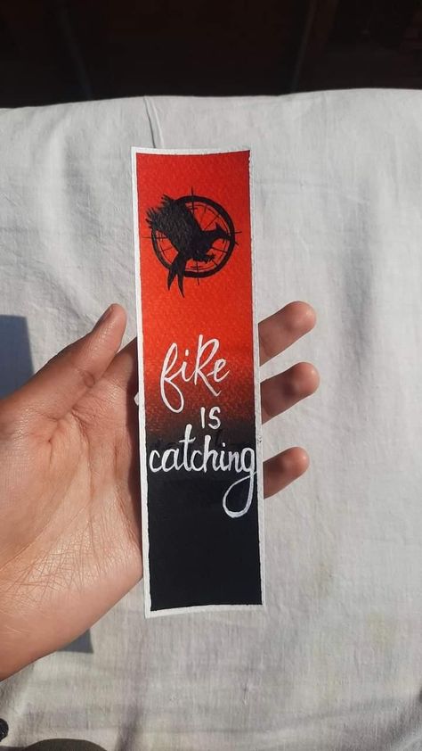 Aesthetic Hunger Games Bookmark, Greek Week Banner, Homemade Bookmark, Hunger Games Drawings, Lungs Drawing, Hunger Games Book, Black Sketchbook, Homemade Bookmarks, The Hunger Games Book