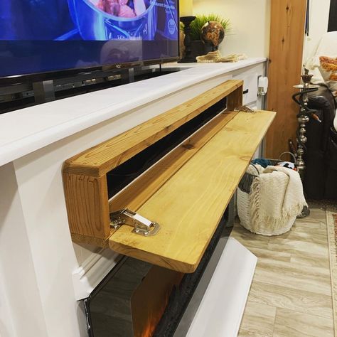 DIY RV Faux Wood Mantle with Hidden Storage Door Hide Soundbar On Mantle, Hidden Storage Mantle Diy, Mantle Storage Fireplace, Soundbar Mantle, Diy Storage Mantle, Hidden Storage Mantle, Hidden Mantle Storage, Mantle Hidden Storage, Diy Mantle With Storage