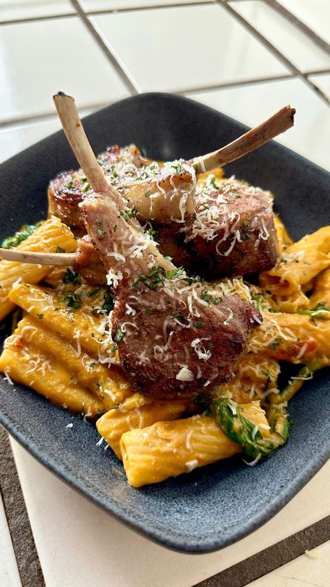 Here we have a Red Creamy Rigatoni Pasta with Spinach topped with Seared Bone-in Lamb Chops. Side note: I would leave out the Basil from being roasted in the oven. I wouldn’t blend the basil with the sauce. Instead I would chop it and add it at the end of the sauce for a fresher taste and a better color to the sauce #pasta #rigatoni #lambchops #easyrecipes #food | Oscarins Kitchen | Eslabon Armado · Ella Baila Sola Lamb Chop Pasta, Creamy Rigatoni, Pasta Rigatoni, Lamb Pasta, Pasta With Spinach, Lamb Chop Recipes, Rigatoni Pasta, Sauce Pasta, Spinach Pasta