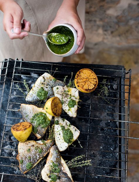 Mojo verde is a Spanish sauce, made from fresh herbs and garlic. In Mallorca I make this barbecued fish with mojo verde with dorada, a local fish, but any firm white fish will do. Make double the quan- tity of mojo verde and enjoy leftovers the next day as a dip or a dressing for salads. Wimbledon Recipes, Spanish Sauce, Family Vegetarian Meals, Mojo Verde, Barbecue Fish, Melissa Hemsley, Gluten Free Bbq, Ocean Food, Citrus Fish