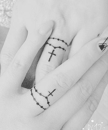 Finger Tattoos: Fingers Crossed, Trade Your Rings for These ... Him And Her Tattoos, Ring Tattoo Designs, Wedding Band Tattoo, Rosary Tattoo, Wedding Ring Tattoo, Finger Tattoo For Women, Tattoo Wedding Rings, Finger Tats, Ring Finger Tattoos