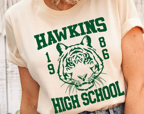 Hawkins High School Shirt, Vintage Hawking Town Shirt, Hawking Eleven Shirt, Hawkins Class Of 1986 T-shirt. School Tshirt Designs, Spirit Wear Designs, Hawkins High School, Class Tshirts, School Spirit Shirts Designs, Team Spirit Shirts, School Shirt Designs, School Spirit Wear, Reunion Shirts