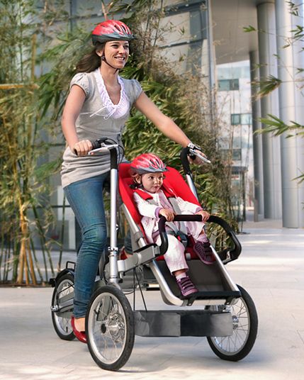 The hot new Taga Bike Stroller converts from a child-toting bike to jogging stroller in seconds. Here's our full review--and why you might want one. A lot. Stroller Reviews, Child Bike Seat, Baby Bike, Bike Trailer, Jogging Stroller, Cool Baby, Bike Seat, Kids Bike, Mother And Baby