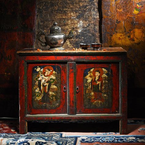 This painted Tibetan side cabinet has incredibly unusual iconography and dates to the 18th century. It is almost unheard of to find Tibetan cabinets with a Taoist theme and it seems likely this piece originated in Eastern Tibet. The figure to the left is the Taoist immortal He Xiangu who is depicted holding a vase in her hand. She is the only female immortal of the eight daoist immortals. This cabinet is of unusual form for Tibetan furniture and it appears to have originally been at least a four door cabinet and reduced in height many years ago. It appears to be one of a pair as the cabinet is handed. There are no examples of similar cabinets or topics in any Tibetan furniture books we have found. This cabinet also has another unusual feature in the form of a spell inscribed on the inner d Tibetan House, Tibetan Furniture, Door Cabinet, Side Cabinet, Dream House Decor, Panel Doors, Antique Collection, Tibet, House Decor