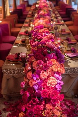 This vibrant Indian wedding filled the room with hot pinks, bright oranges, and gorgeous purples – from the floral arrangements to the furniture and lighting, every detail was wow-worthy. Rustic Wedding Decorations, Boda Mexicana, Long Table, Indian Wedding Decorations, Wedding Deco, Romantic Weddings, Color Wheel, Purple Wedding, Simple Weddings