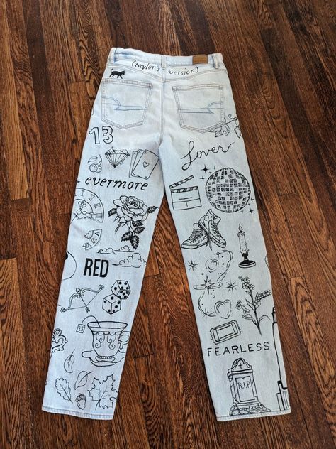 Eras Tour Jeans Diy, Eras Tour Pants Diy, Art Pants Ideas, Eras Tour Painted Jeans, Taylor Swift Painted Jeans, Taylor Swift Arts And Crafts, Eras Tour Outfits Pants, Eras Tour Pants, Eras Tour Painting