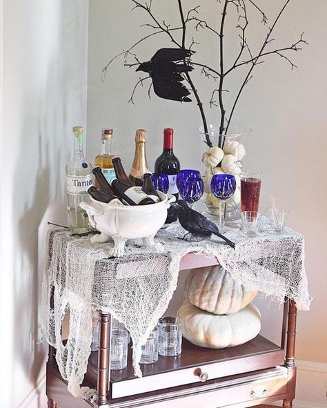 Here are attractive and colorful Halloween ideas for your console tables, home bars, shelves, or buffets Classy Halloween Party, Halloween Brunch, Halloween Bar Cart, Halloween Table Centerpieces, Martha Stewart Halloween, Halloween Bar, Classy Halloween, Pumpkin Garland, Bar Cart Styling