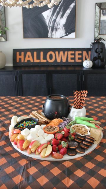 Halloween Fondue Ideas, Halloween Chocolate Fountain, Caramel Apple Bar Cauldron, Halloween Fondue, Chocolate Cauldron, Halloween S’mores Dip, S’mores Ghost Dip, Fondue Dessert, Candy Cauldron