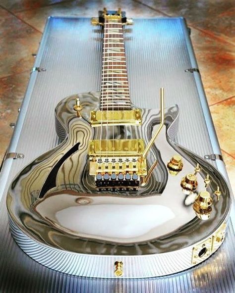 Wild looking chrome Les Paul with gold hardware! #lespaul #gibsonlespaul… Unique Guitars, Cool Electric Guitars, Guitar Collection, Gibson Guitars, Beautiful Guitars, Guitar Art, Custom Guitars, Guitar Design, Music Guitar