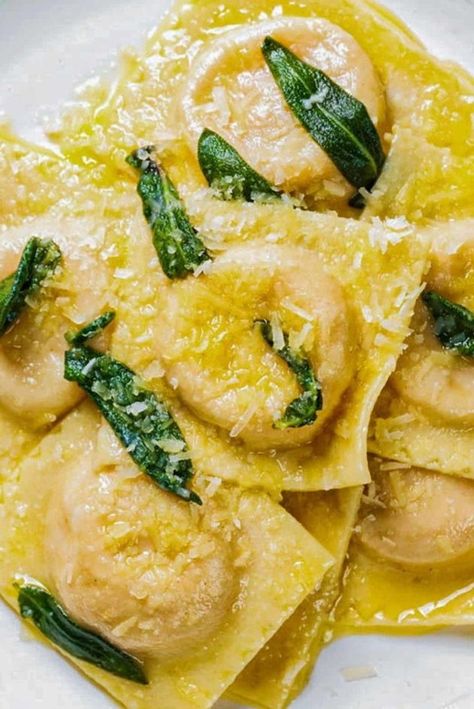 This Homemade Butternut Squash Ravioli features fresh pasta made from scratch, a rich butternut squash filling and then tossed in a simple butter sage sauce before serving. It’s perfect for a cozy fall dinner! Homemade Butternut Squash Ravioli, Sauces For Butternut Squash Ravioli, Butternut Squash Ravioli Sauce, Ravioli Sauce, Butternut Squash Ravioli, Butternut Squash Pasta, Filling Food, Fall Dinner, Italian Pasta