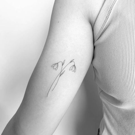 Fine line style snowdrop flower tattoo placed on the Snowdrop Flowers Tattoo, Snow Drop Tattoos, Snow Drop And Poppy Tattoo, Poppy And Snowdrop Tattoo, Sideways Flower Tattoo, Snow Flower Tattoo, Snowdrop Line Tattoo, Snow Drop Flower Tattoos, Snow Drops Tattoo