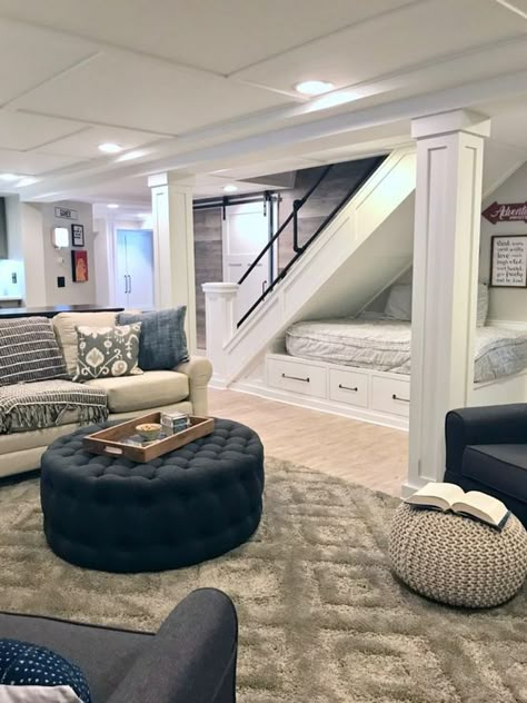 A HGTV fixer Upper basement remodel with shiplap wood walls, sliding barn doors, and industrial chic accents. A cozy reading and lounging nook was created under the stairs with extra storage. Cost To Finish Basement, Cool Basement Ideas, Cozy Basement, Basement Apartment, Basement House, Small Basements, Basement Makeover, Basement Bedrooms, Basement Decor