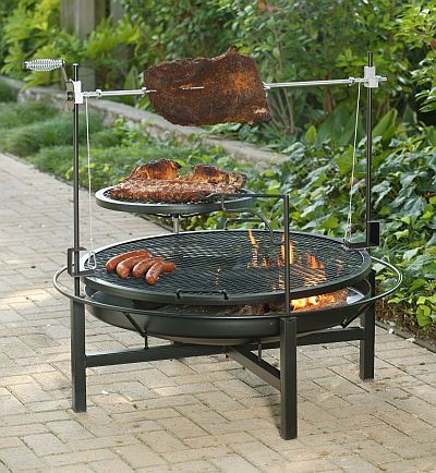 The Round Rock Grill, Rotisserie, and Fire Pit Cowboy Fire Pit, Cowboy Grill, Diy Fire Pit Ideas, Fire Pit With Rocks, Fire Pit Cooking, Rustic Fire Pits, Outdoor Bbq Grill, Fire Pit Ring, Fire Pit Bbq