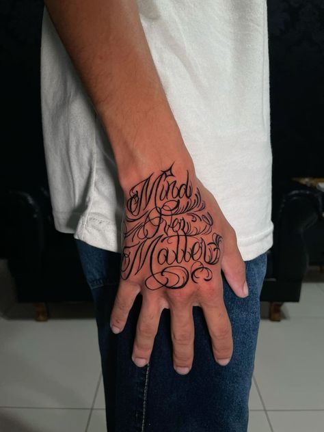 Mind Over Matter Tattoo Design, Hand Tattoos For Guys Words, Traps Tattoo Men, Trap Tattoo Ideas, Hand Tattoo Lettering, Writing On Hand Tattoo, Gangsta Tattoos Men Design, Hand Tattoos For Guys Men, Gangsta Style Tattoo