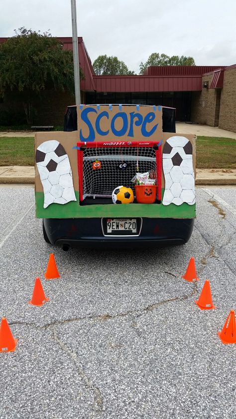 Soccer trunk or treat for preschool Soccer Theme Trunk Or Treat, Trunk Or Treat Soccer Theme, Sports Themed Trunk Or Treat Ideas, Trunk Or Treat Basketball Theme, Sports Theme Trunk Or Treat, Trunk Or Treat Sports Theme, Soccer Halloween Tournament, Soccer Trunk Or Treat, Sports Trunk Or Treat Ideas