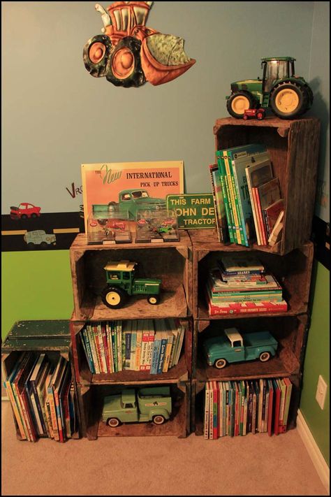 Crate Shelves - boys room. Finally found the perfect solution to store all of my boys books. Old wooden crates from a nearby vegetable farm. Love the colours and vintage look they have. The boys loved it too. Farm Library, Farm Boy Room, Tractor Bedroom, John Deere Room, Tractor Room, Farm Bedroom, Farm Room, Old Crates, Big Boy Bedrooms