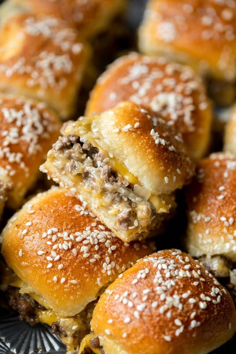 These easy and delicious ground beef Cheeseburger Sliders are a perfect party appetizer or for your next game day gathering. Made with simple ingredients and served with the best burger sauce! Get ready to double the recipe because just 12 sliders go FAST! #gamedayfood #cheeseburgersliders #sliderrecipes #groundbeef #footballfood #cheeseburgers #easyappetizers #krollskorner #appetizers #groundbeefrecipes #partyfood #partyappetizers Sheet Pan Cheeseburger Sliders, Sauce For Sliders, Recipes Sliders, Tawnie Graham, Best Burger Sauce, Krolls Korner, Savory Butter, Butter Rolls, Burger Mix