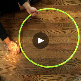 Wrap string light around a hula hoop for this GORGEOUS lighting idea! | Wrap string light around a hula hoop for this GORGEOUS lighting idea! | By HometalkFacebook Hula Hoop Christmas Decoration, Hula Hoop Light, Hula Hoop Rug, Diy Christmas Lights, Hula Hoops, Home Fix, Hula Hoop, Dollar Store Crafts, Diy Lighting