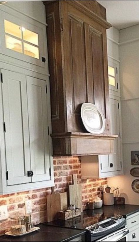 Range Hood Without Cabinets, Vintage Brick Backsplash, Headboard Hood Vent, Kitchen Buffets And Sideboards, Vintage Range Hood Ideas, Wooden Hoods Over Stove, Wooden Stove Hood, Wooden Hood Vent Cover, Wooden Vent Hood Ideas