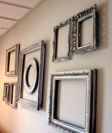 Add interest to a big blank wall with spray painted thrift store frames!  Layer them for additional interest.  http://christinasadventures.com/2012/04/empty-frame-wall-bedroom-dcor.html Silver Frames On Wall, Wall Pinning, Wall Pinterest, Chalkboard Walls, Empty Picture Frames, Big Blank Wall, Empty Frame, Empty Frames, Old Picture Frames