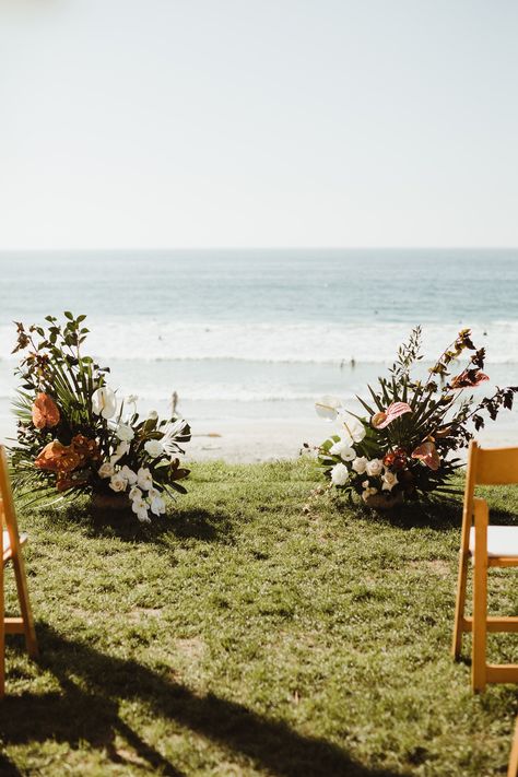 These satellite floral pieces looked amazing at the beach wedding. They didn't take away from the view of the ocean and were the perfect alternative to a traditional arch! See more on our blog! #archalternative #floralpieces #beachwedding Wedding No Arch Ideas, No Arch Ceremony, Arbor Alternatives Wedding Altars, Alternatives To Wedding Arch, Low Floral Wedding Ceremony, Beach Wedding No Arch, Alternative Arches For Wedding, Alternative Wedding Arch Ideas, Wedding Arbour Alternative