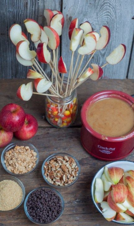 Caramel Apple Dip, serve warm with apple slices from Farmwife Feeds #recipe #crockpot #apples Carmel Apple Slices Bar, Apple Dip Charcuterie Board, Apple Dip Bar, Halloween Carmel Apples Slices, Halloween Party Caramel Apple Bar, Dipped Apples Gourmet, Carmel Dipped Apple Slices, Apple Slice Dipping Bar, Apple Sticks