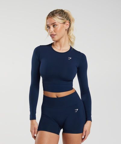 - Shop now!

The Gymshark Everyday Seamless Long Sleeve Crop Top is a must-have for any fitness enthusiast. It's made with a lightweight, breathable fabric that will keep you cool and comfortable during your workouts. The seamless construction prevents chafing, and the long sleeves offer extra coverage. This top is also available in a variety of colors, so you can find the perfect one to match your style.

#gymshark #fitness #workout Gymshark Outfit, Gymwear Outfits, Fitness Wear Outfits, Gymshark Women, Sport Top, Gym Tops, Cropped Tops, Long Sleeve Crop, Gym Outfit