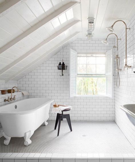 Not only will adding an attic bathroom give your partner, children, or guests their own private space, it will also make sure the upper level is more than just a dinky storage zone. Some of our favorite designers took on the attic bathroom design challenge (with great results), and here's how to bring their expertise to your own reno. #hunkerhome #bathroom #atticbathroom #bathroomideas #bathroominspo Attic Bathrooms, Attic Bathroom Ideas, Small Attic Bathroom, Makeover Kamar Mandi, Slanted Walls, Ford Interior, Open Showers, Small Attic, Attic Ideas