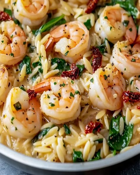 Try this easy Garlic Orzo Tuscan Shrimp recipe with creamy Parmesan sauce, garlic, and spinach. Ready in just 20 minutes for a quick meal! Creamy Shrimp Orzo With Spinach, Garlic Butter Shrimp And Spinach Orzo, Tuscan Shrimp Orzo With Spinach, Shrimp Spinach Tortellini, Garlic Orzo Tuscan Shrimp, Shrimp Orzo Asparagus Recipes, Orzo Recipes Shrimp, Tuscan Shrimp Orzo, Orzo And Shrimp Recipes