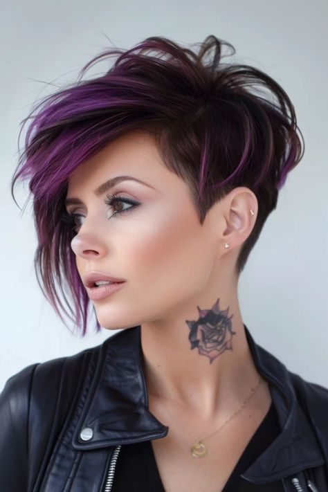 Woman with a short asymmetrical purple haircut and a tattoo on her neck. Purple Undercut Pixie, Haircuts Woman Long, Pixie Purple Hair, Pixie Punk Haircut, Pixie Hairstyles With Undercut, A Line Pixie Haircut, Short Hair With Purple Highlights, Purple Pixie Haircut, Female Shaved Hairstyles