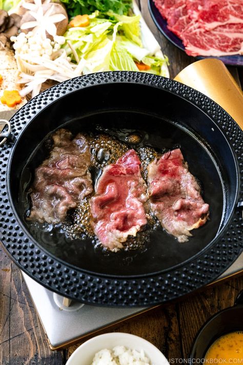 Cozy up at your next get-together with friends and family with this homemade Japanese Sukiyaki recipe. Served with seared marbled beef and a variety of vegetables cooked in a soy sauce broth, it makes a heart-warming meal to share at the table! #sukiyaki #hotpot #nabe | Easy Japanese Recipes at JustOneCookbook.com Hotpot Recipe Broth, Sukiyaki Recipe Beef, Japanese Sukiyaki Recipe, Japanese Sukiyaki, Beef Hotpot, Japanese Hot Pot, Sukiyaki Recipe, Japanese Beef, Easy Japanese Recipes