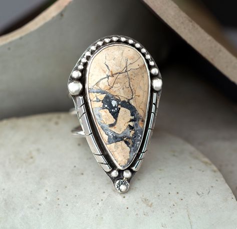 large teardrop tan with gray matrix maligano jasper cabochon on a tapered thick wide open band size 8 Rodeo Jewelry, Silversmithing Jewelry, Metal Jewelry Making, Chunky Silver Rings, Gray And Brown, Maligano Jasper, Zuni Jewelry, Metalsmithing Jewelry, Jasper Ring