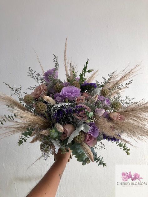 CBR680 Weddings at the beach , soft romantic bridal bouquet with pampas grass lilas and purple Flowers at Tulum Riviera Maya and Playa del Carmen Mexico by Cherry Blossom  #bridalbouquet #pampasgrassbouquet Purple And Pampas Grass Wedding, Lavender Boho Wedding Decor, Boho Purple Bouquet, Purple Wild Flower Bouquet, Pampas Grass And Lavender Wedding, Boho Wedding Bouquet Purple, Lavender And Pampas Wedding, Purple Pampas Grass Bouquet, Purple Boho Wedding Decor