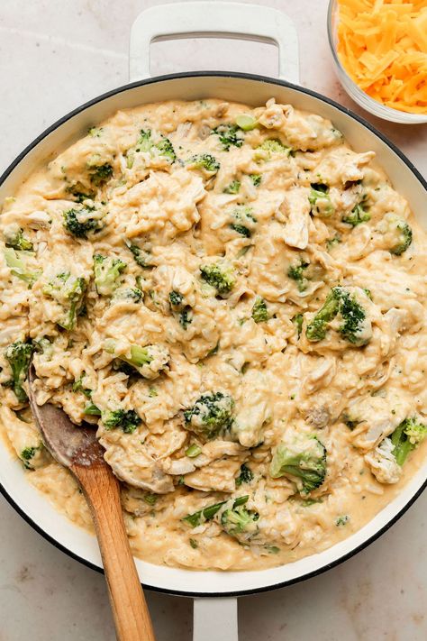 If you love our baked Chicken and Rice Casserole, then this is the easy dinner recipe for you! We've taken that classically good combination of cheese, chicken, broccoli, and rice that is so loved and turned it into a simple stovetop version made all in one skillet. Cheesy Chicken Skillet, Baked Chicken And Rice Casserole, Chicken Broccoli Rice Cheese Casserole, Chicken Rice Skillet, Cooked Rice Recipes, Baked Chicken And Rice, Cheesy Broccoli Rice, Broccoli And Rice, Chicken Broccoli Rice Casserole