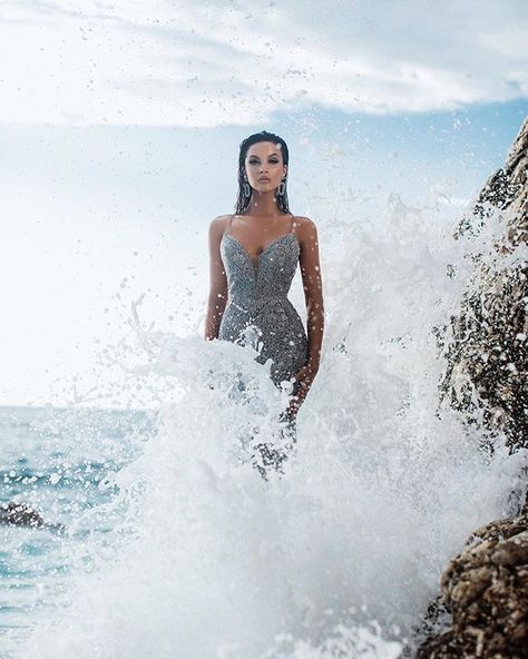 Iconic by @endritmertiri @tarikedizofficial Ocean Birthday Photoshoot, Dress Pictures On The Beach, Silver Dress Photoshoot, Ocean Photoshoot, Angelic Dress, Beach Fashion Shoot, Tarik Ediz Dresses, Creative Fashion Photography, Fashion Model Poses