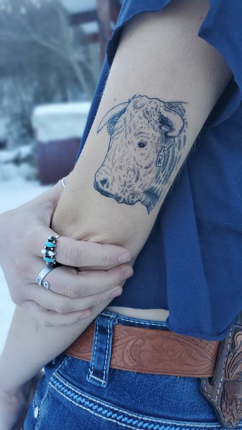 Hereford bull with the family brand on the ear tag on the tricep. Cow Family Tattoo, Hereford Tattoo, Cattle Tag Tattoo, Hereford Cow Tattoo, Cattle Brand Tattoos For Women, Cattle Tattoo Ideas, Ear Tag Tattoo, Cattle Brand Tattoo, Cow Tag Tattoo