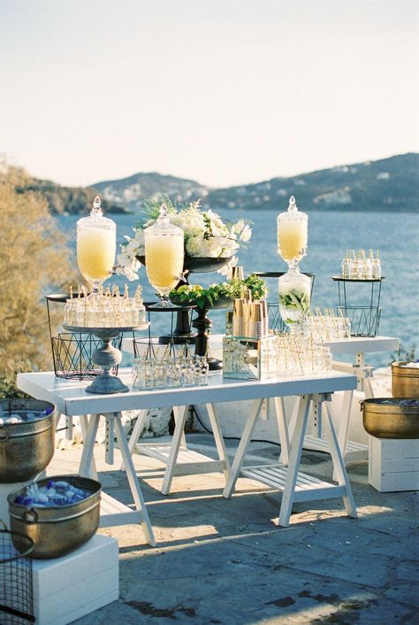 The Best Ways to Keep Guests Hydrated at Your Wedding Mykonos Themed Party, Greek Wedding Food, Lime Infused Water, Greece Party, Lemonade Bar, Wedding Drink Station, Mykonos Wedding, Wedding Food Drink, Bar Catering