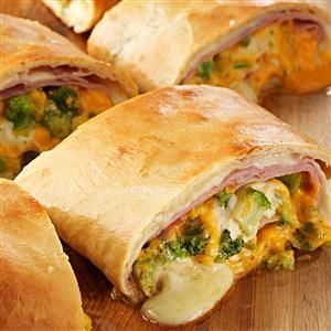 Ham cheese and broccoli Stromboli Loaded with ham, broccoli and cheese, Ham And Cheese Stromboli Recipe, Cheese Stromboli Recipe, Cheese Stromboli, Jarred Alfredo Sauce, Pizza Calzone, Stromboli Recipe, Frozen Bread Dough, Italian Meats, Hot Sandwich