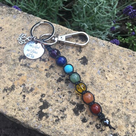 A beautiful keychain/ bag charm. This is handmade using 1mm waxed cotton cord and 8mm beads. Using a 25mm split ring and clasp. This comes with a pretty stainless steel disc which says ‘ no mud no lotus’ and with a steel lotus. A lovely gift to give or receive. The meaning of each chakra: Crown Chakra - Amethyst- Purple - The highest chakra, our spiritual center: enlightenment, unity Third Eye Chakra - Lapis lazuli- Indigo - Perception center: wisdom, consciousness, intuition, power of No Mud No Lotus, Spiritual Center, Keychain Purse, 8mm Beads, Writing Gifts, Keychain Bag, Third Eye Chakra, Amethyst Purple, Crown Chakra