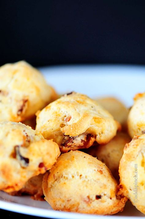 Cheddar and Bacon Puffs Recipe | ©addapinch.com Bacon Puffs Recipe, Bacon Cheese Puffs, Nibbles Ideas, Bacon Puffs, Cheese Puffs Recipe, Sausage And Bacon, Recipes For The Whole Family, Puff Recipe, Tailgate Food