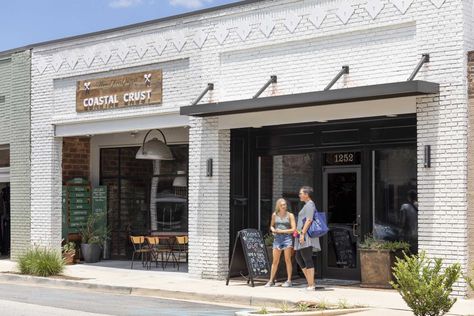 Coastal Crust | DP3 Architects White Brick Retail Store Exterior, White And Black Commercial Building, Modern Store Fronts, Storefront Exterior, Shopping Center Design, Boutique Exterior, Brick And Mortar Boutique, Warehouse Exterior, Modern Industrial Office