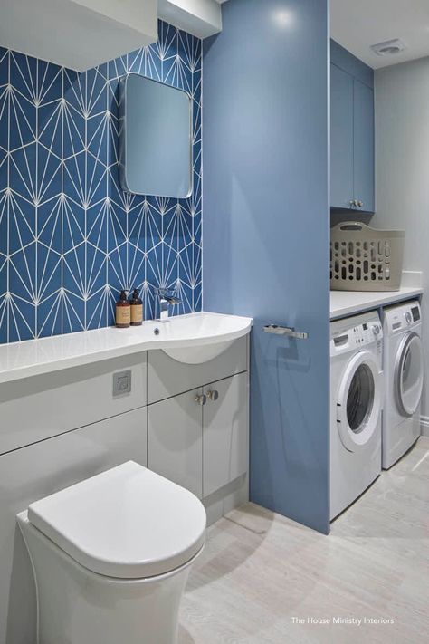 Combined Utility room with WC cloakroom.  Grey vanity unit cupboards, concealed WC with square flush plate.  A cast marble basin and countertop on the left hand side units.  White quartz countertop above the appliances.  The wall tiles are Mandarin Stone.  Karndean grey wood flooring. For more images of this project  https://www.thehouseministry.co.uk/stroud.html Bathroom And Washing Room, Utility With Shower Room, Utility Cupboard In Bathroom, Laundry And Shower Room, Utility And Shower Room Combined, Shower Room And Utility, Bathroom With Utility Room, Small Utility Room With Toilet Downstairs Loo, Utility Rooms With Toilet