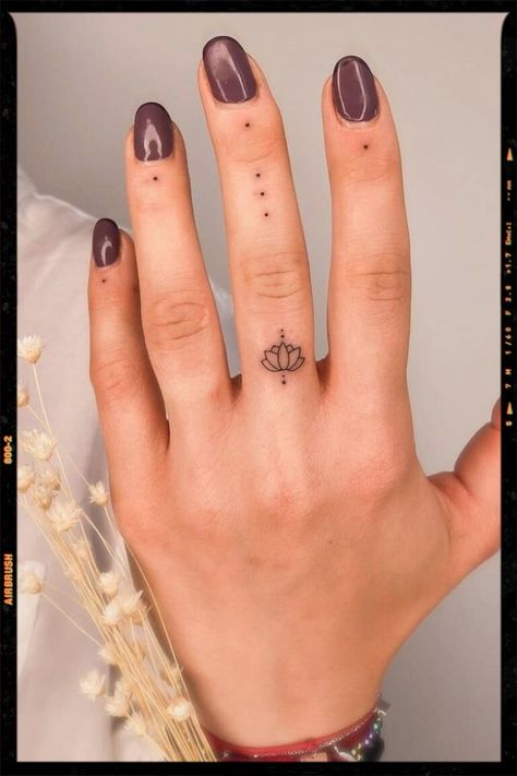 TATTOOS Dot Tattoos On Fingers Meaning, Mini Tats Cross, Small Tattoos Mandala, Cute Simple Tattoos For Women With Meaning, Lotus Tatoos Meaning, Dot Finger Tattoo Meaning, Finger Dots Tattoo, Finger Dot Tattoo Meaning, Womens Finger Tattoos Simple