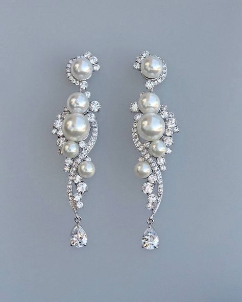 "Let our 'Tilly' jewelry range help you feel your absolute best on your wedding day. Choose earrings that will 'wow' your guests as you dance the bridal waltz with your love. Shimmering and sparkly, these featherlight earrings suit many styles of wedding dress. They are designed with love and made from the highest-quality Swarovski cubic zircon crystals and ivory shell pearls. Wear 'Tilly' on your big day, and whenever you want to recapture that unforgettable princess feeling. ❣ Available in tar Pendulum Earrings, Japan Wedding, Chandelier Wedding, Wedding Earrings Chandelier, Long Bridal Earrings, Bridal Bracelet Pearl, Geode Jewelry, Bridal Earrings Chandelier, Crystal Earrings Wedding