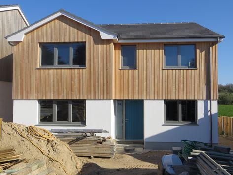 Siberian Larch Cladding, 4/5 Bed New Build in Rock, Cornwall. Half Cladded House, Cladding Front Of House, External Cladding Ideas House Exteriors, Larch Cladding Exterior, House Cladding Ideas, Cedar Cladding House, Render And Cladding, Cladding House Exterior, Exterior Cladding Ideas